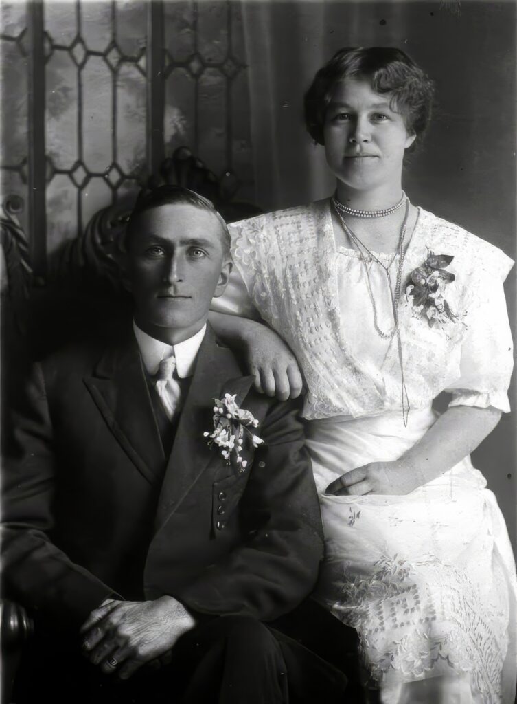 A man and woman from the Hillman Family are sitting together.