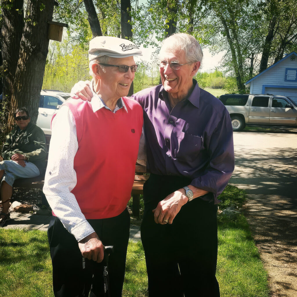 Kenny and Keith Sveinson celebrating their 86th birthdays outside the Creamery in Markerville